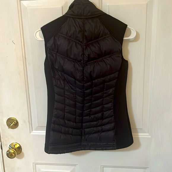 Michael Kors black lightweight puffer vest. It says XS but is really a S-M. - Picture 2 of 4